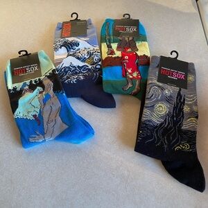 Four (4) pairs of HotSox art socks (Women’s size 4-10)